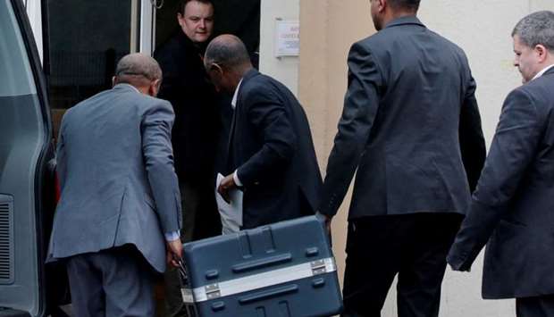 Men unload a case containing the black boxes from the crashed Ethiopian Airlines Boeing 737 MAX 8 outside the headquarters of France's BEA air accident investigation agency in Le Bourget, north of Paris, France