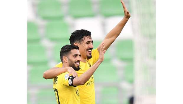 Al Saddu2019s Hassan al-Haydos (L) and Baghdad Bounedjah celebrate after their teamu2019s win over Al Sailiya yesterday. At bottom, Al Duhailu2019s Youssef El Arabi celebrates in his unique style after scoring against Umm Salal. PICTURES: Noushad Thekkayil and Shemeer Rasheed.