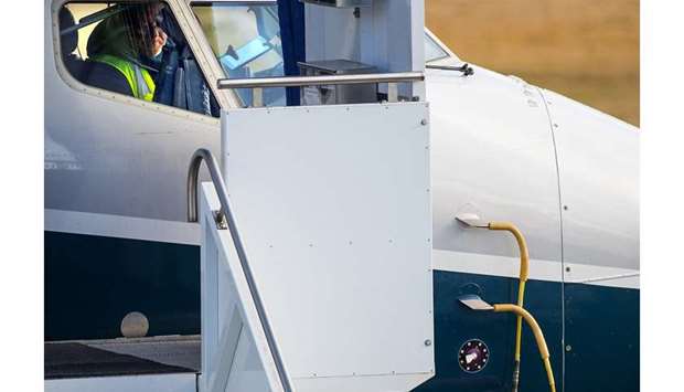 A worker is seen inside a Boeing 737 MAX 9 at the Renton plant. The circular sensor seen at bottom right measures the planeu2019s angle of attack, the angle between the airflow and the wing. This sensor on 737 MAX planes is under scrutiny as a possible cause of two recent fatal crashes. Photo: Mike Siegel / The Seattle Times)