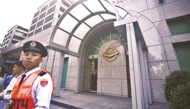 A security guard stands outside the Asian Development Bank headquarters in Manila. Pakistan and ADB have agreed in principle to kick-start implementation of three-year country partnership strategy programme with loan portfolio of $6bn for various economic sectors.