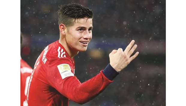 Bayern Munichu2019s James Rodriguez celebrates scoring their fifth goal to complete his hat-trick yesterday. (Reuters)