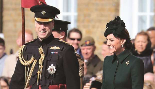 Prince William, Duke of Cambridge and Catherine, Duchess of Cambridge attend the St Patricku2019s Day parade to present shamrocks to officers and guardsmen of the 1st Battalion Irish Guards, at Cavalry Barracks in Hounslow, west London, yesterday.
