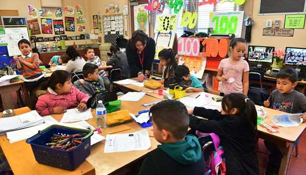 Telfair Elementary School first grade teacher Gutierrez works with her students in Pacoima, California, some 30 minutes drive from downtown Los Angeles.