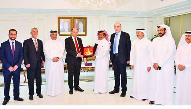 Qatar Chamber chairman Sheikh Khalifa bin Jassim al-Thani hands over a token of recognition to Lebanonu2019s Minister of Agriculture Dr Hussein al-Laqis during a meeting held in Doha recently.