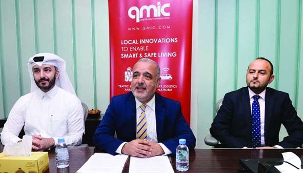 Dr Adnan Abu-Dayya (centre) announces findings of the report as other officials from Qmic look on.