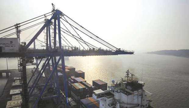 A container ship sits docked at the Jawaharlal Nehru Port, operated by Jawaharlal Nehru Port Trust (JNPT), in Navi Mumbai (file). The Competition Commission of India last year ordered an investigation into suspected antitrust violations by DP World and Denmarku2019s AP Moller-Maersk at the terminals they operate at JNPT.