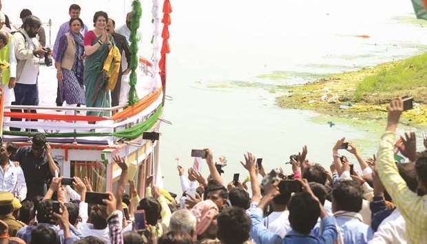 Priyanka Gandhi Vadra gestures to supporters at the start of a boat trip to Varanasi along the Ganges river as part of election campaign, in Manaiya village, near Prayagraj (Allahabad), yesterday.