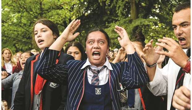 School students perform the hakka during a vigil in Christchurch yesterday.