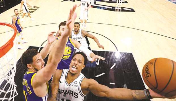 San Antonio Spurs shooting guard DeMar DeRozan (right) shoots the ball as Golden State Warriors shooting guard Klay Thompson defends during the second-half of their NBA game at AT&T Center. PICTURE: USA TODAY Sports
