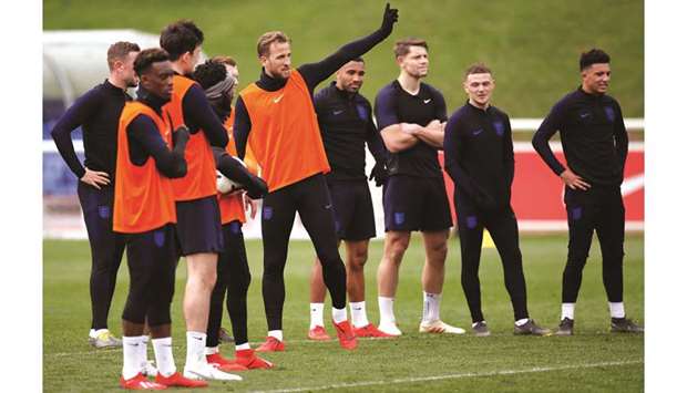 Englandu2019s Harry Kane (centre) gestures during training with teammates at Georgeu2019s Park in Burton upon Trent, Britain. (Reuters)