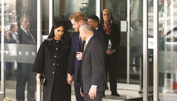 Prince Harry and Meghan, Duchess of Sussex, visit the New Zealand House to sign the book of condolence on behalf of the royal family in London yesterday.