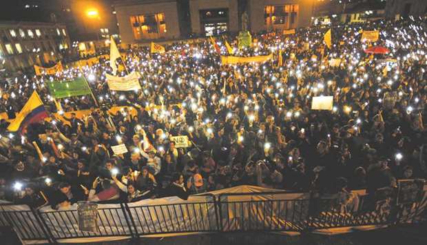People participate in a protest against Colombiau2019s President Ivan Duqueu2019s call for changes to the Special Jurisdiction for Peace (JEP) law, in Bogota, Colombia.