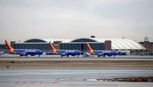 Southwest Airlines Co. Boeing 737 MAX 8 aircraft sit next to the maintenance area after landing at Midway International Airport in Chicago, Illinois, US, March 13, 2019