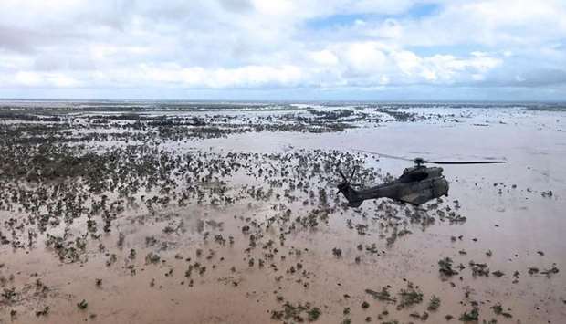 An Oryx helicopter from the SANDF (South African National Defence Forces) flies during an air relief drop mission over the flooded area around Beira, central Mozambique.