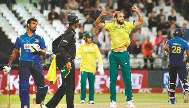 Sri Lankau2019s Thisara Perera (left) looks on as South Africau2019s Imran Tahir celebrates their teamu2019s victory in the T20 match at Newlands Stadium in Cape Town. (AFP)