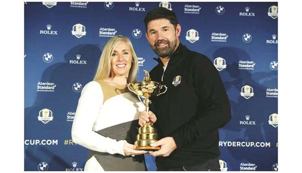 In this January 8, 2019, picture, Padraig Harrington (right) poses with the Ryder Cup trophy and his wife Caroline after being appointed as the Europe captain for the 2020 edition of the tournament. (Reuters)