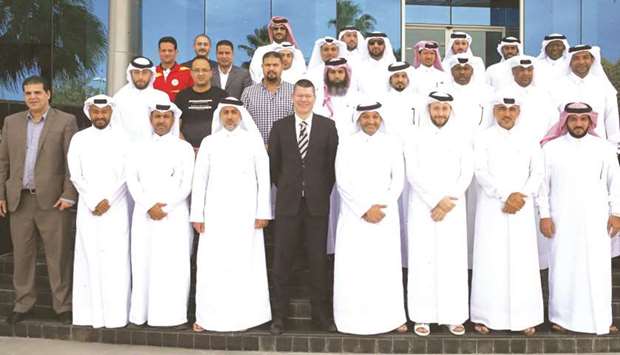 CEO of QSL Hani Taleb Ballan (bottom fourth right) poses with the participants of the workshop.
