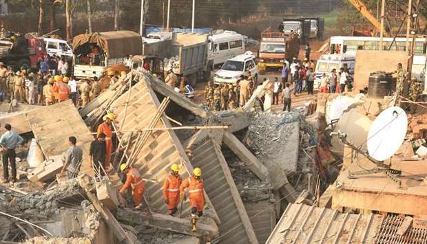 National Disaster Response Force personnel search for survivors a day after an under-construction building collapsed in Dharwad district of Karnataka, yesterday.