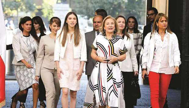 Venezuelau2019s opposition leader Juan Guaidou2019s wife, Fabiana Rosales walks next to Chilean first lady Cecilia Morel during her visit at the government palace in Santiago, Chile, yesterday.