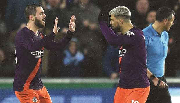 Sergio Aguero (right) scored Manchester Cityu2019s late winner in the FA Cup tie against Swansea on Saturday. In hindsight it appears VAR would have disallowed the goal for a marginal offside call. (AFP)