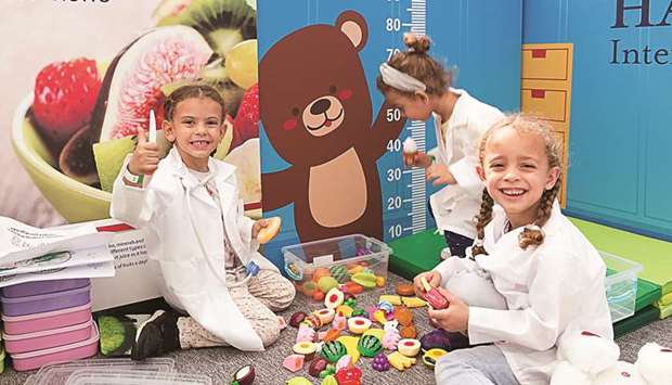 Children enjoy an activity at the Mini Teddy Bear Hospital at Doha Festival City.