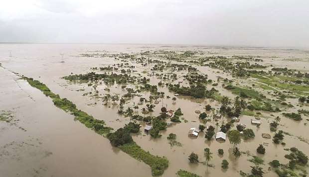 This handout picture released by the United Nations World Food Programme yesterday shows an aerial view of flooded houses near the heavily-populated Mozambican port city of Beira.