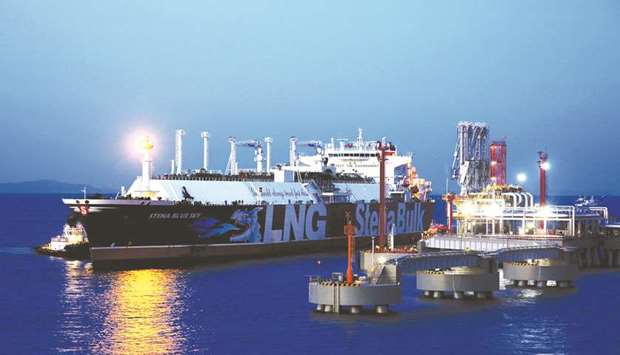An LNG tanker is seen at the liquefied natural gas terminal owned by Chinese company ENN Group, in Zhoushan, Zhejiang province, China (file). Asia, the biggest consuming region for LNG, uses most of it for heating and power but a mild winter, an abundance of new supplies and a better preparedness of Chinese buyers meant prices went against the trend over the past few months by falling rather than rising.