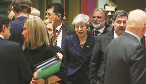 Britainu2019s Prime Minister Theresa May and Britainu2019s Permanent Representative to the EU Tim Barrow attend a European Union leaders summit in Brussels. EU diplomats said Mayu2019s request for a delay until June 30 seemed likely to be met by an EU preference for Britain to have completed formalities and begin a status-quo transition to departure before Europeans elect a new parliament from May 23.