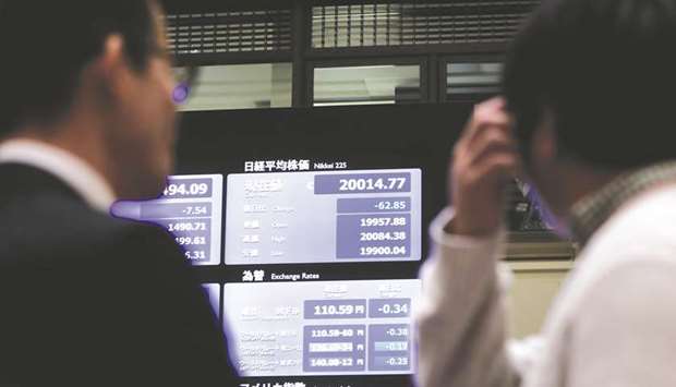 A screen displays the Nikkei 225 Stock Average price at the Tokyo Stock Exchange (file). Appetite for Japanese equities have yet to pick up, however, with foreigners continuing to net sell local stocks in the cash market.