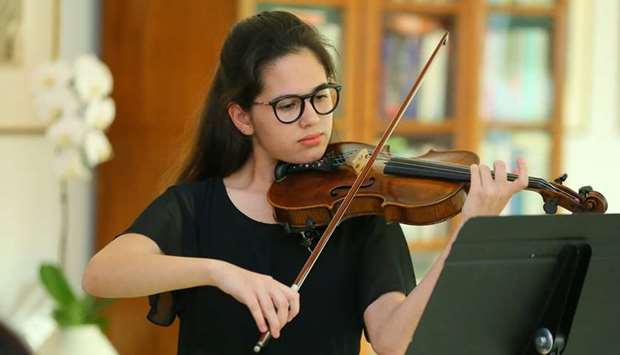 VIOLINIST: Julia Salvaggio, laureate of first Qatar National Music Competition, playing at the event. Photos by Ram Chand