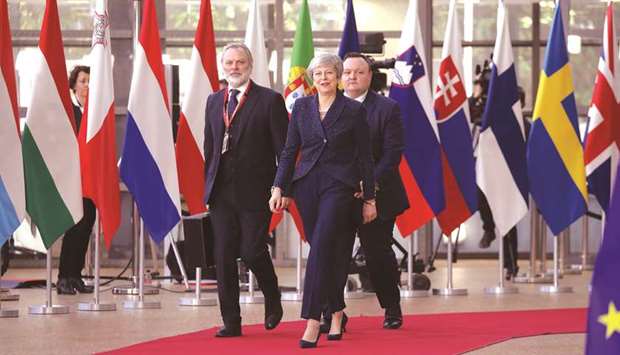 Prime Minister Theresa May arrives in Brussels on the first day of an EU summit focused on Brexit.