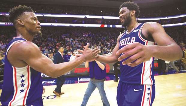Philadelphia 76ers guard Jimmy Butler (left) and centre Joel Embiid celebrate their victory over the Boston Celtics at Wells Fargo Center. PICTURE: USA TODAY Sports