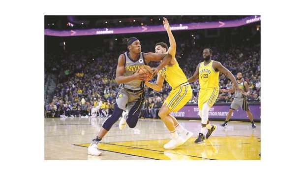 Indiana Pacersu2019 Myles Turner (left) attempts to drive past Golden State Warriorsu2019 Klay Thompson during the NBA match on Thursday. (USA TODAY Sports)