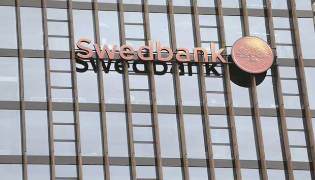 Swedbanku2019s logo is pictured on its Lithuanian headquarters in Vilnius. Swedbanku2019s board backed chief executive Birgitte Bonnesen yesterday as some investors questioned an external report into allegations of money-laundering through its Baltic branches.