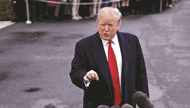 US President Donald Trump speaks to members of the media in Washington. In a televised interview Trump denied that trade talks with China had hit a bump in the road, saying they were nearing a conclusion.