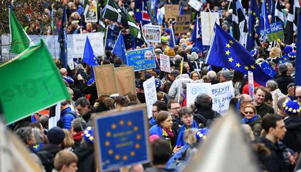 EU supporters, calling on the government to give Britons a vote on the final Brexit deal, participate in the 'People's Vote' march in central London