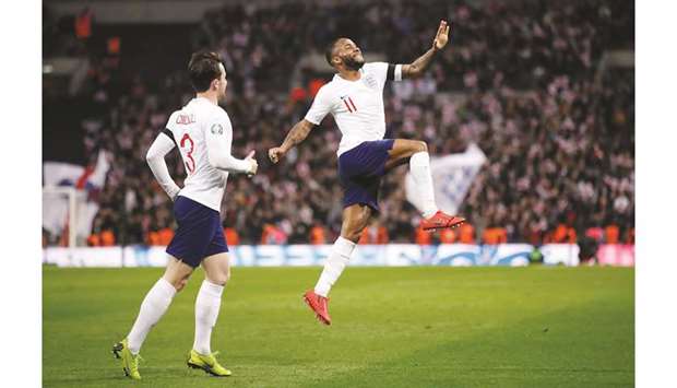 Englandu2019s Raheem Sterling (right) celebrates after completing his hat-trick during the Euro 2020 Qualifier Group A match against Czech Republic at Wembley Stadium in London on Friday. (Reuters)