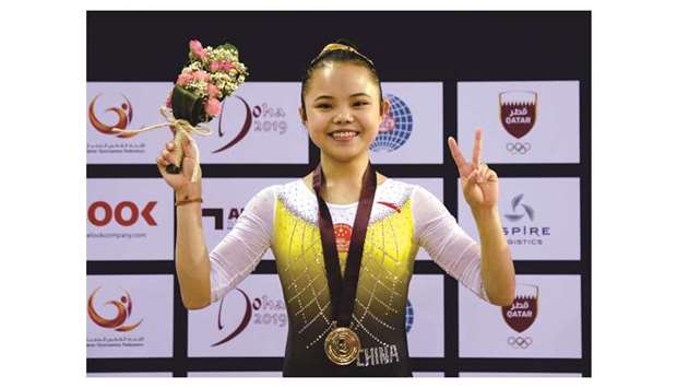 Chinese teenager Li Qi celebrates with her gold medal after winning in the Balance Beam at the Artistic Gymnastics Individual Apparatus World Cup at Aspire Zone yesterday. PICTURES: Thajudheen