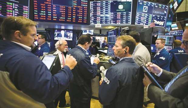 Traders work on the floor of the New York Stock Exchange (file). As Wall Street braces for what may be the first US profit decline since 2016, investors say the first quarter may not mark the low point for 2019 earnings.