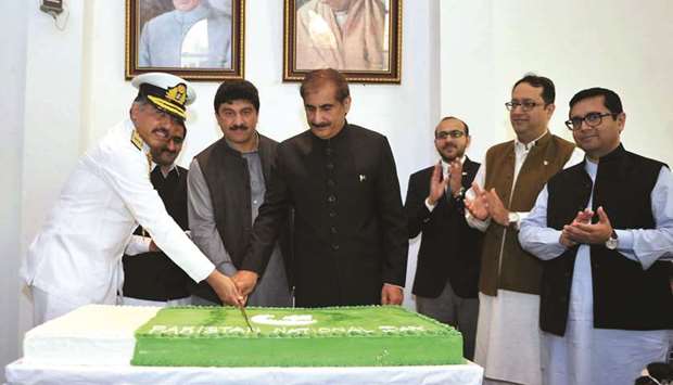 Ambassador Syed Ahsan Raza Shah and other dignitaries at the cake-cutting ceremony.