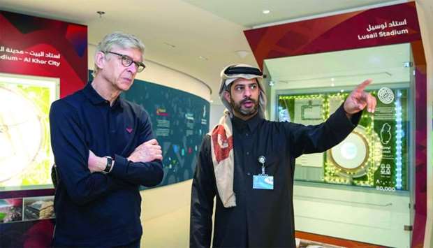 Former Arsenal manager Arsene Wenger (left) and FIFA World Cup Qatar 2022 CEO Nasser al-Khater.rnrn