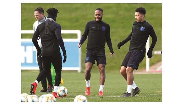 Englandu2019s Jadon Sancho (right) and Raheem Sterling train yesterday on the eve of their Euro 2020 qualifying match against Montenegro. (Reuters)