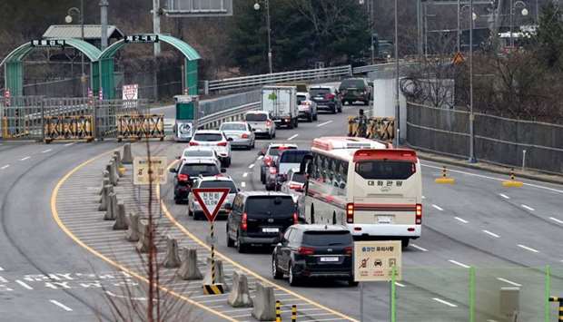 Vehicles carrying South Korean officials of the inter-Korean liaison office head to North Korea's border city of Kaesong at a border checkpoint, just south of the Demilitarized zone dividing the two Koreas, in Paju