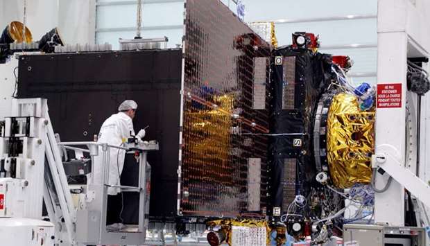 Technicians work on the Inmarsat S-Band/Hellas-Sat 3 satellite in the clean room facilities of the Thales Alenia Space plant in Cannes, France.  File photo: February 3, 2017.