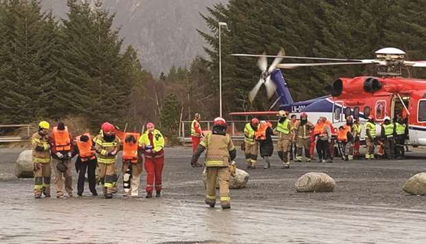 Stranded passenger rescued by helicopter from the cruise ship Viking Sky being taken care of near Romsdal, Norway.