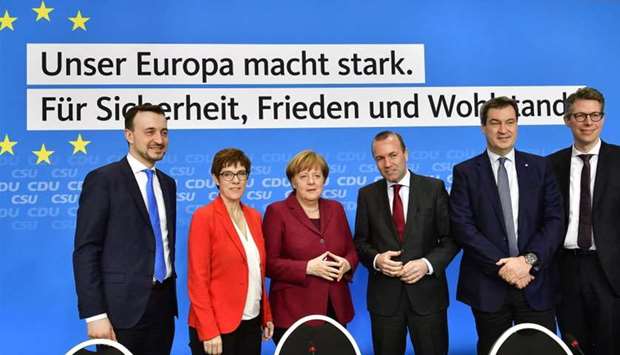 (L-R) The Secretary General of Germany's conservative Christian Democratic Union (CDU) Paul Ziemiak, party leader Annegret Kramp-Karrenbauer, party member and German Chancellor Angela Merkel, top candidate of the European People's Party (EPP) for 2019 European elections Manfred Weber, leader of the conservative Christian Social Union (CSU) party Markus Soeder and CSU Secretay General Markus Blume pose during a party board meeting in Berlin