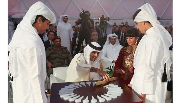 His Highness the Amir placed the magnetic piece in the logo of the power plant to officially inaugurate it