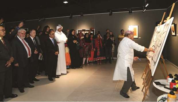 Dignitaries watching an artist at work.