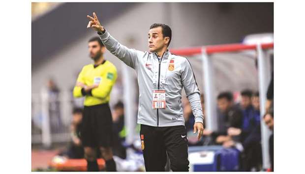 Chinau2019s new head coach Fabio Cannavaro gestures during the China Cup third place play-off match against Uzbekistan. (AFP)