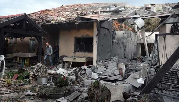 A damaged house that was hit by a rocket can be seen north of Tel Aviv, Israel